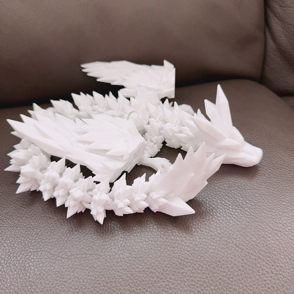 A snowy white dragon. 45cm and $15